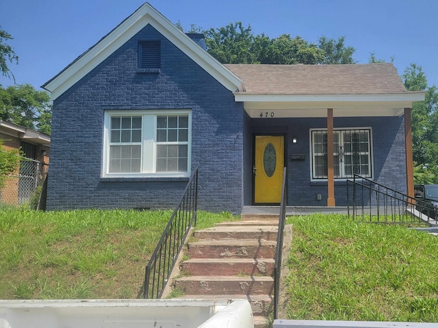 view of front of home featuring covered porch and a front yard