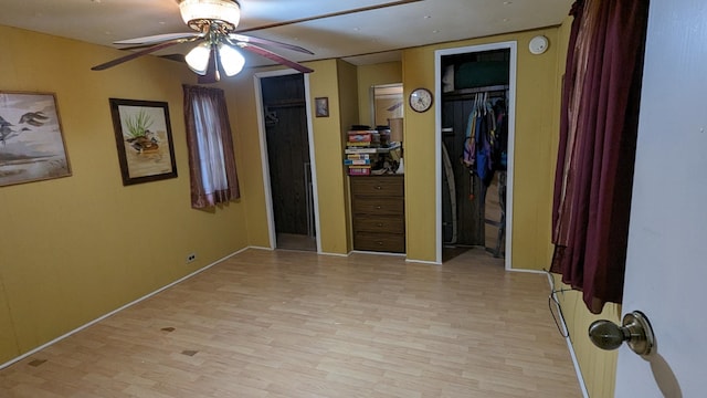 unfurnished bedroom featuring ceiling fan and light hardwood / wood-style floors