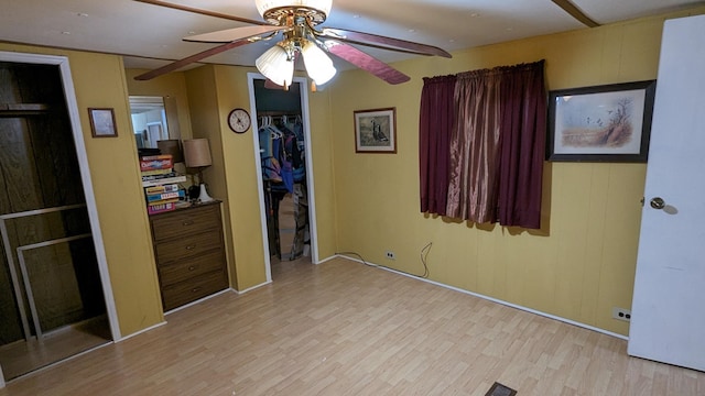 interior space featuring light hardwood / wood-style floors and ceiling fan