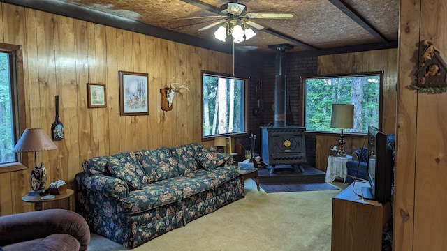 living room with carpet flooring and wooden walls