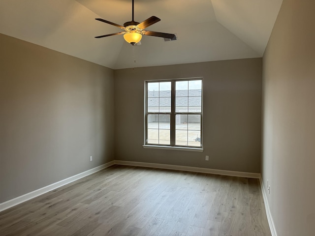 unfurnished room with ceiling fan, lofted ceiling, and light hardwood / wood-style flooring