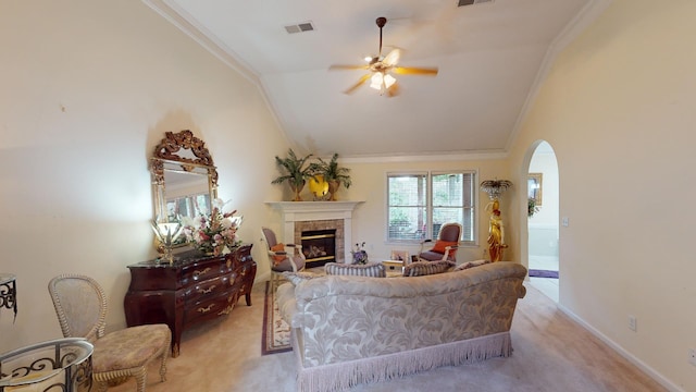 carpeted living room with ornamental molding, ceiling fan, and lofted ceiling