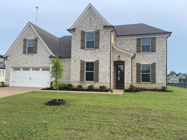 115 Misty Ridge Loop, Oakland, TN 38060 - view of front of property featuring a front lawn and a garage