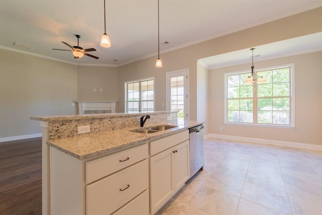 kitchen featuring pendant lighting, ceiling fan, white cabinets, dishwasher, and sink