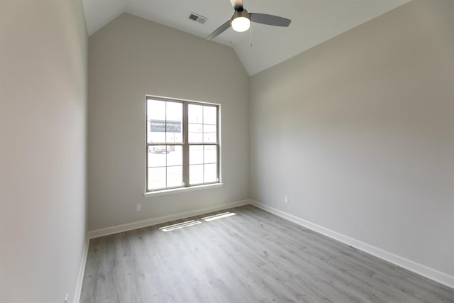 unfurnished room with light hardwood / wood-style flooring, ceiling fan, and vaulted ceiling