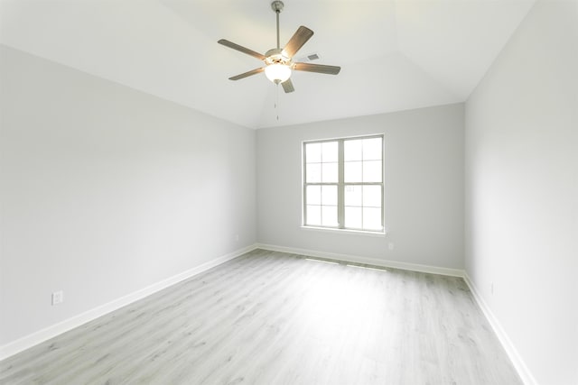 unfurnished room with ceiling fan, lofted ceiling, and light hardwood / wood-style flooring