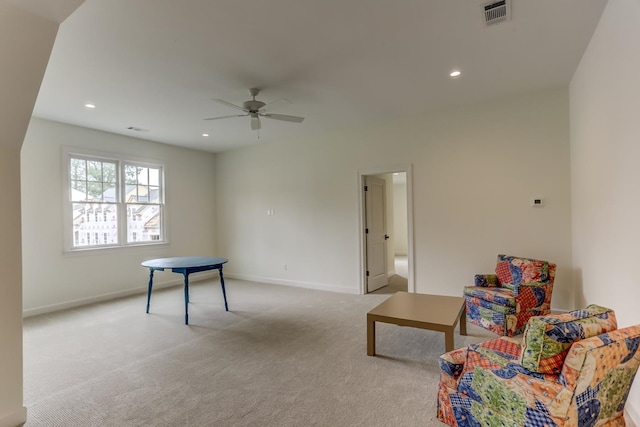 recreation room with light carpet and ceiling fan