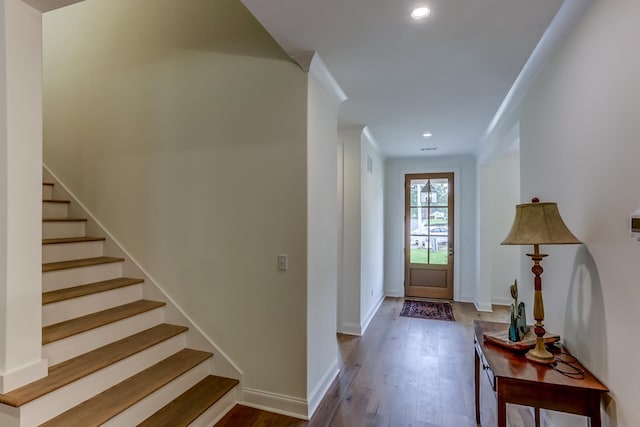 foyer with dark hardwood / wood-style floors