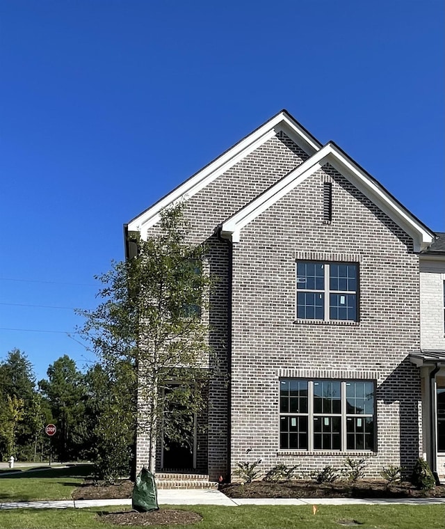 view of home's exterior featuring a lawn