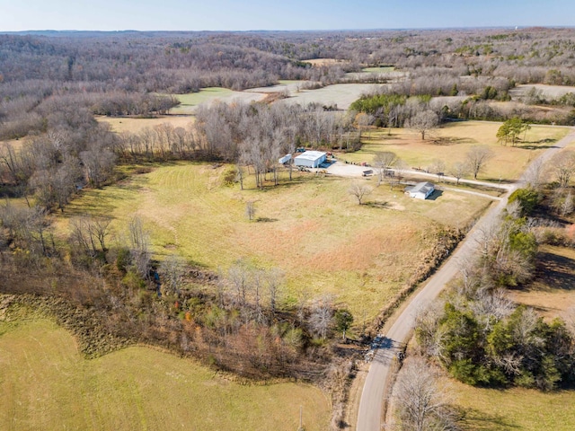 birds eye view of property with a rural view