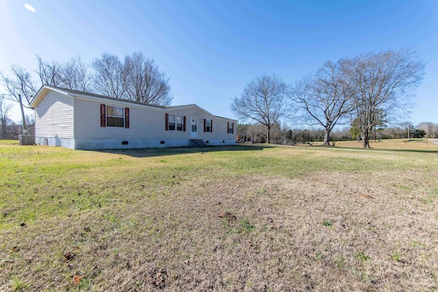 exterior space featuring a yard and central AC unit