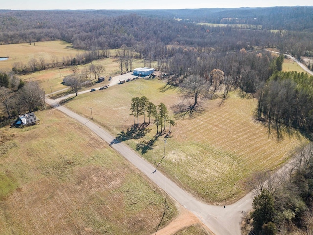 birds eye view of property featuring a rural view