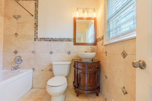 full bath with vanity, tile walls, toilet, and tile patterned floors