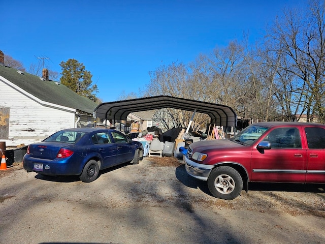 view of vehicle parking with a carport