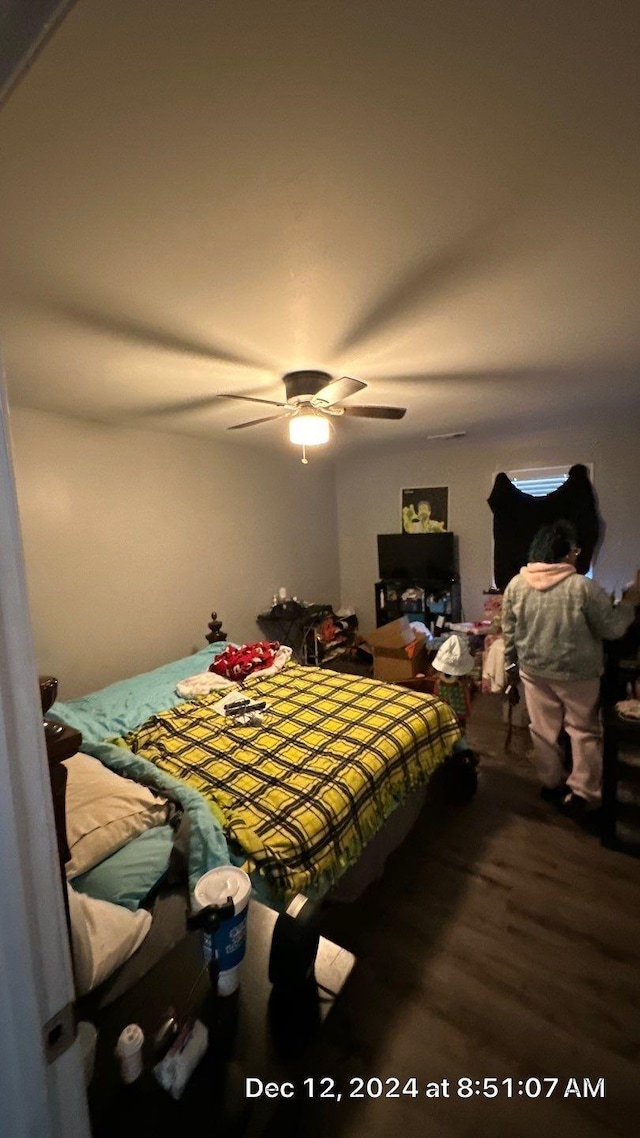 bedroom with hardwood / wood-style flooring and ceiling fan