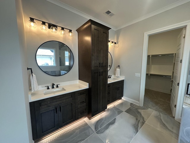 bathroom featuring vanity and ornamental molding