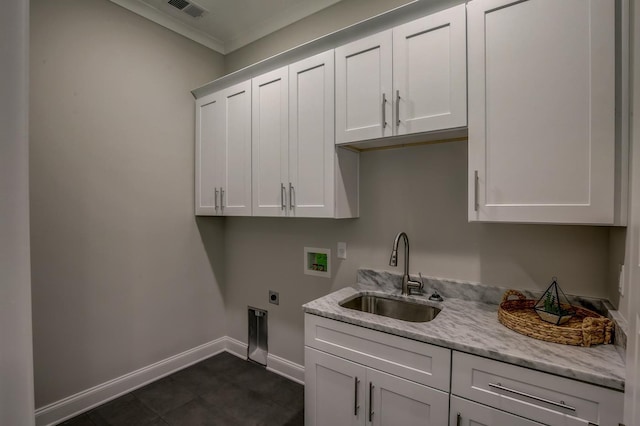 laundry room featuring sink, crown molding, cabinets, hookup for a washing machine, and hookup for an electric dryer