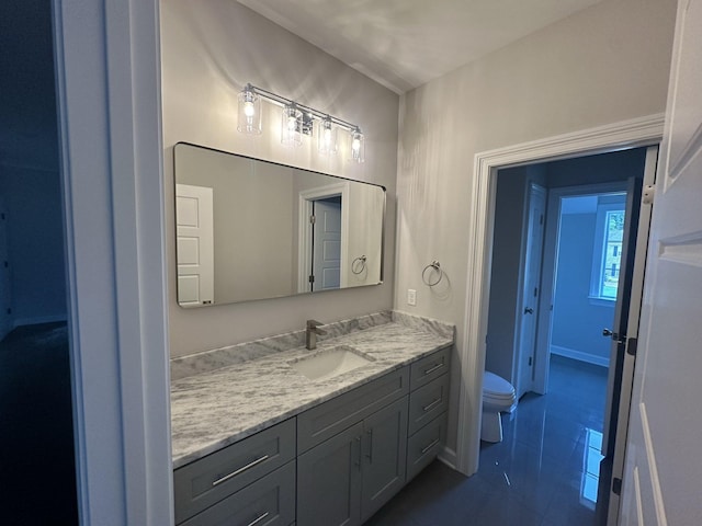 bathroom with vanity and toilet