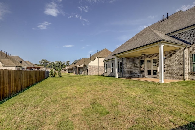 view of yard featuring a patio and ceiling fan