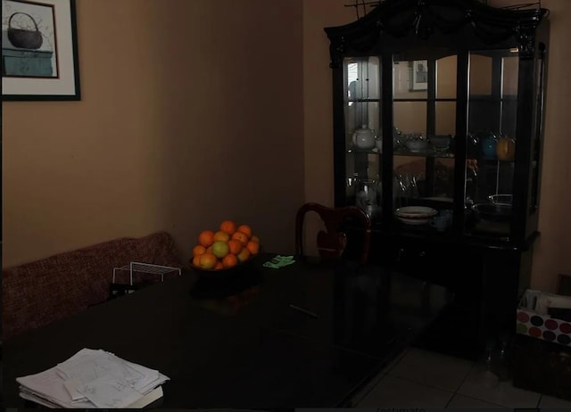 dining space featuring light tile patterned floors