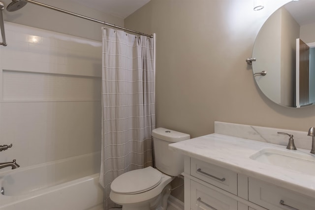 full bathroom featuring shower / bath combo, toilet, and vanity with extensive cabinet space