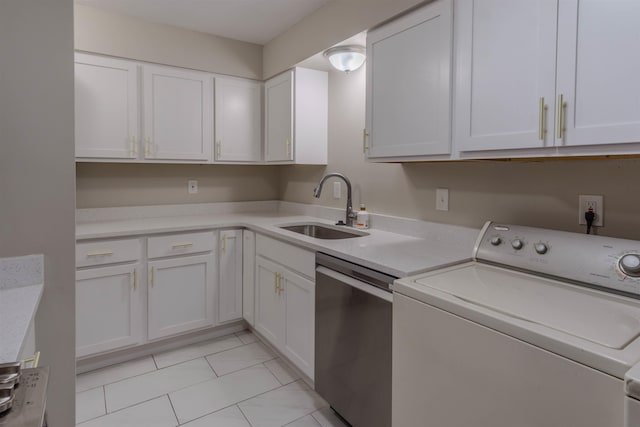 laundry area featuring washer / dryer, light tile floors, and sink