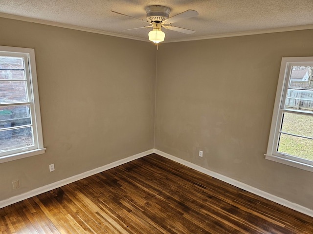 empty room featuring a textured ceiling, dark hardwood / wood-style floors, and ceiling fan