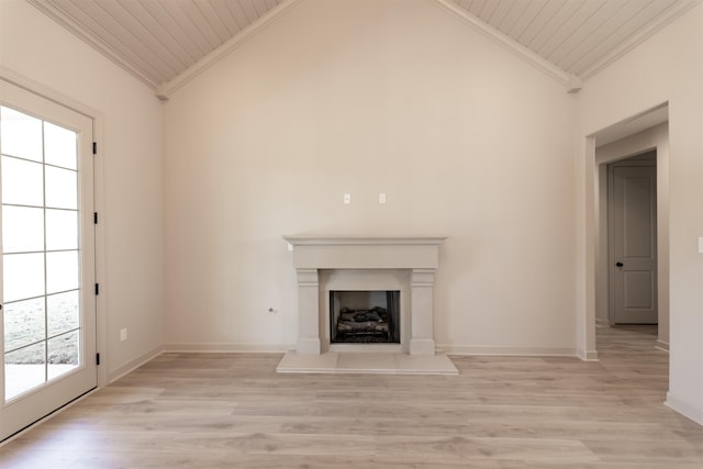 unfurnished living room featuring crown molding, light hardwood / wood-style floors, vaulted ceiling, and wooden ceiling