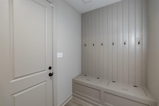 mudroom with light hardwood / wood-style flooring