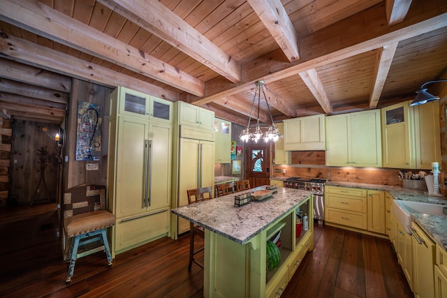 kitchen with dark hardwood / wood-style flooring, decorative light fixtures, beamed ceiling, a center island, and wood ceiling