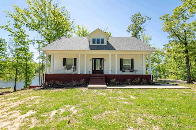 view of front of property featuring a front lawn and covered porch