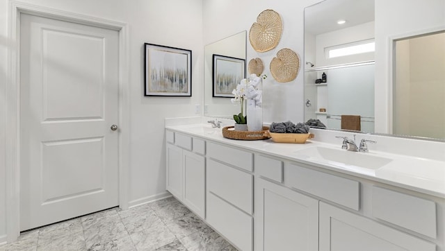 bathroom with dual vanity and tile patterned flooring