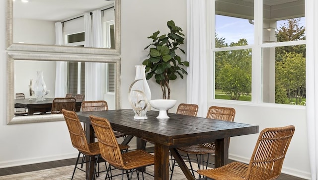 dining space featuring dark hardwood / wood-style flooring