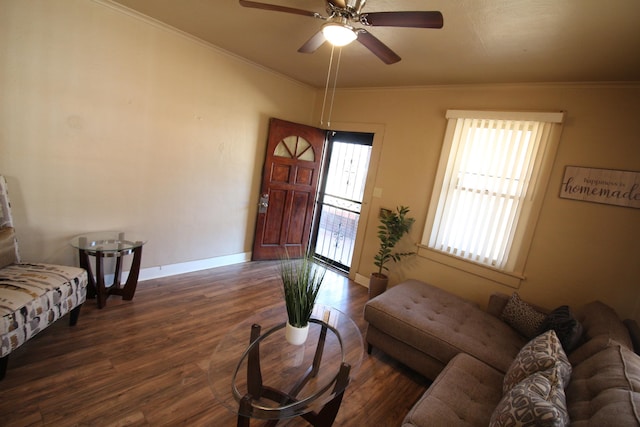 living room with ceiling fan, dark hardwood / wood-style floors, and crown molding