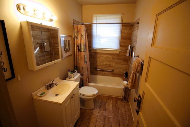 full bathroom featuring shower / bath combination with curtain, toilet, hardwood / wood-style flooring, and vanity with extensive cabinet space