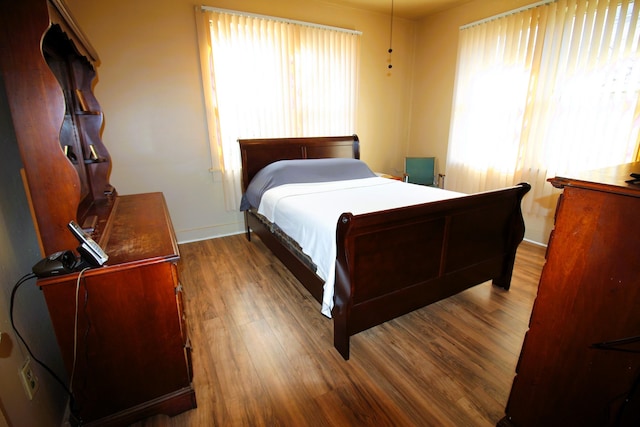 bedroom with hardwood / wood-style floors