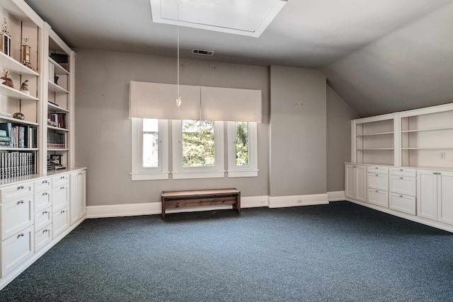 additional living space with lofted ceiling and dark carpet