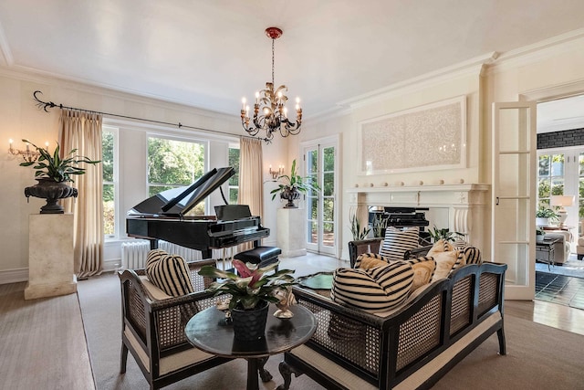 sitting room featuring a chandelier, radiator, french doors, and crown molding