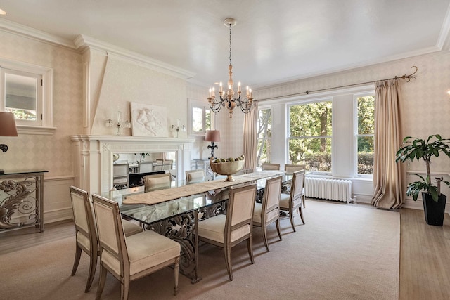 dining area featuring light colored carpet, a chandelier, radiator heating unit, and a healthy amount of sunlight