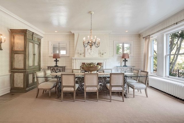 dining room featuring radiator heating unit, light colored carpet, crown molding, and an inviting chandelier