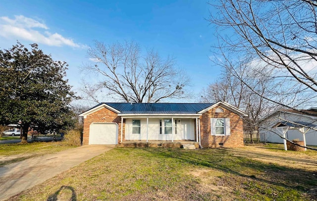 ranch-style house featuring a front yard and a garage