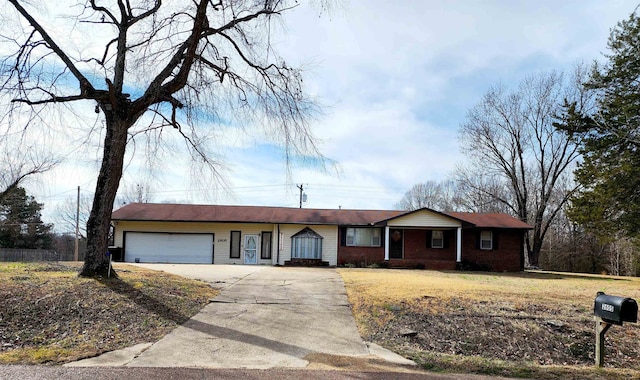 single story home featuring a front yard and a garage