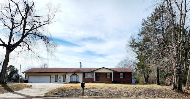 single story home with a front lawn and a garage