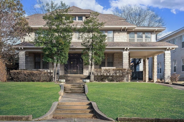 view of front facade featuring a front lawn and covered porch