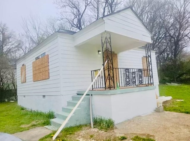 view of property exterior featuring a porch