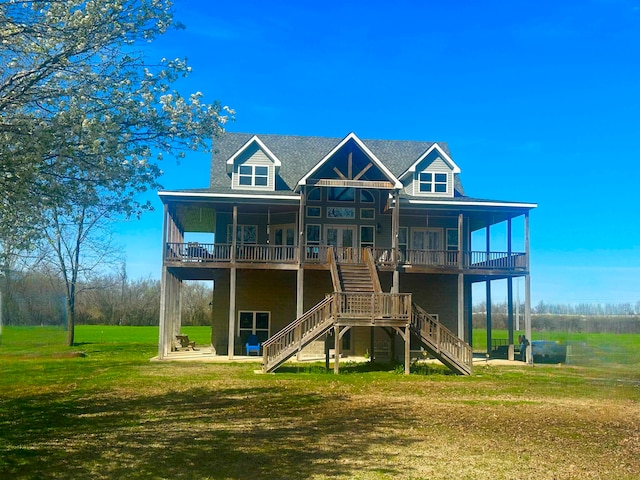 rear view of property with a lawn