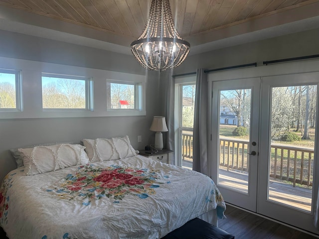 bedroom with wooden ceiling, dark hardwood / wood-style flooring, a chandelier, multiple windows, and access to outside