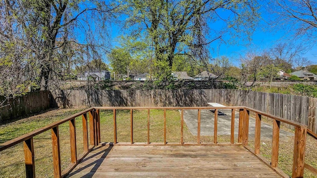 wooden deck featuring a yard