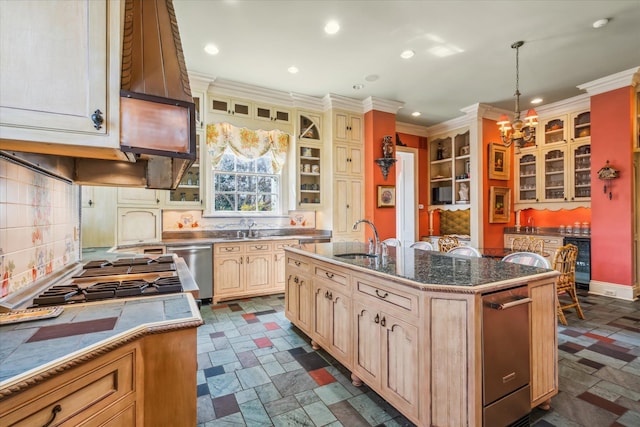 kitchen featuring dark tile floors, sink, a chandelier, and pendant lighting