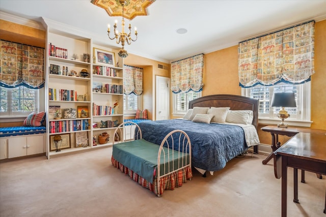 carpeted bedroom with an inviting chandelier and crown molding